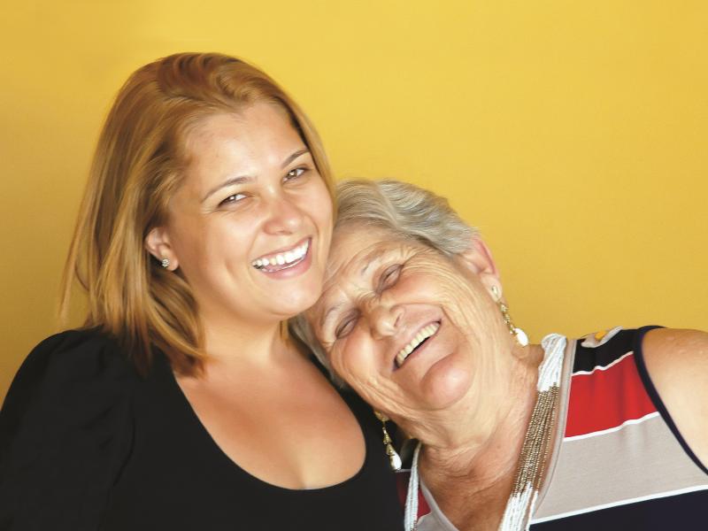 Mother and daughter smiling