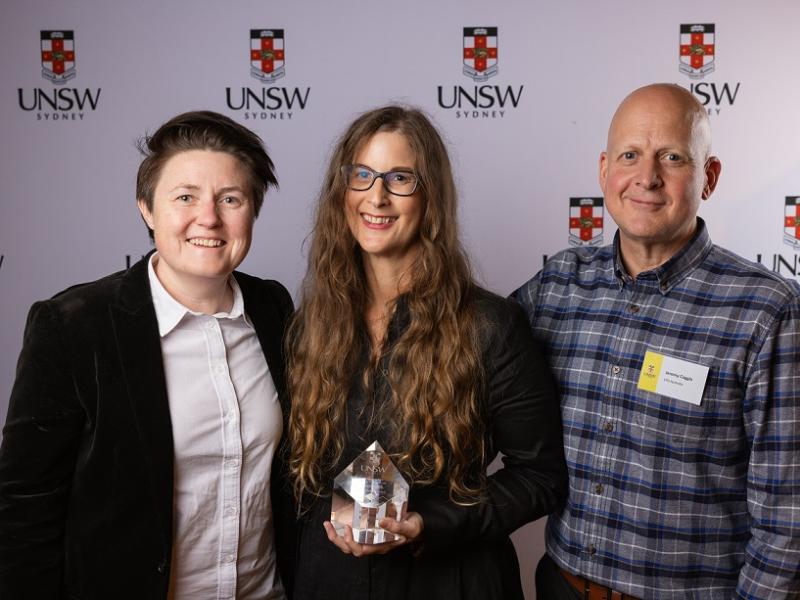 Pictured from left: Mind Executive Director Katie Larsen, Dr Louise Byrne (holding trophy) and Mind Board Director Jeremy Coggin